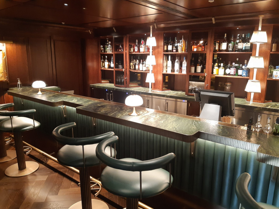 Leather clad bar and backbar with fluted brass trims